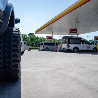 Cars waiting in long line to refuel at petrol station